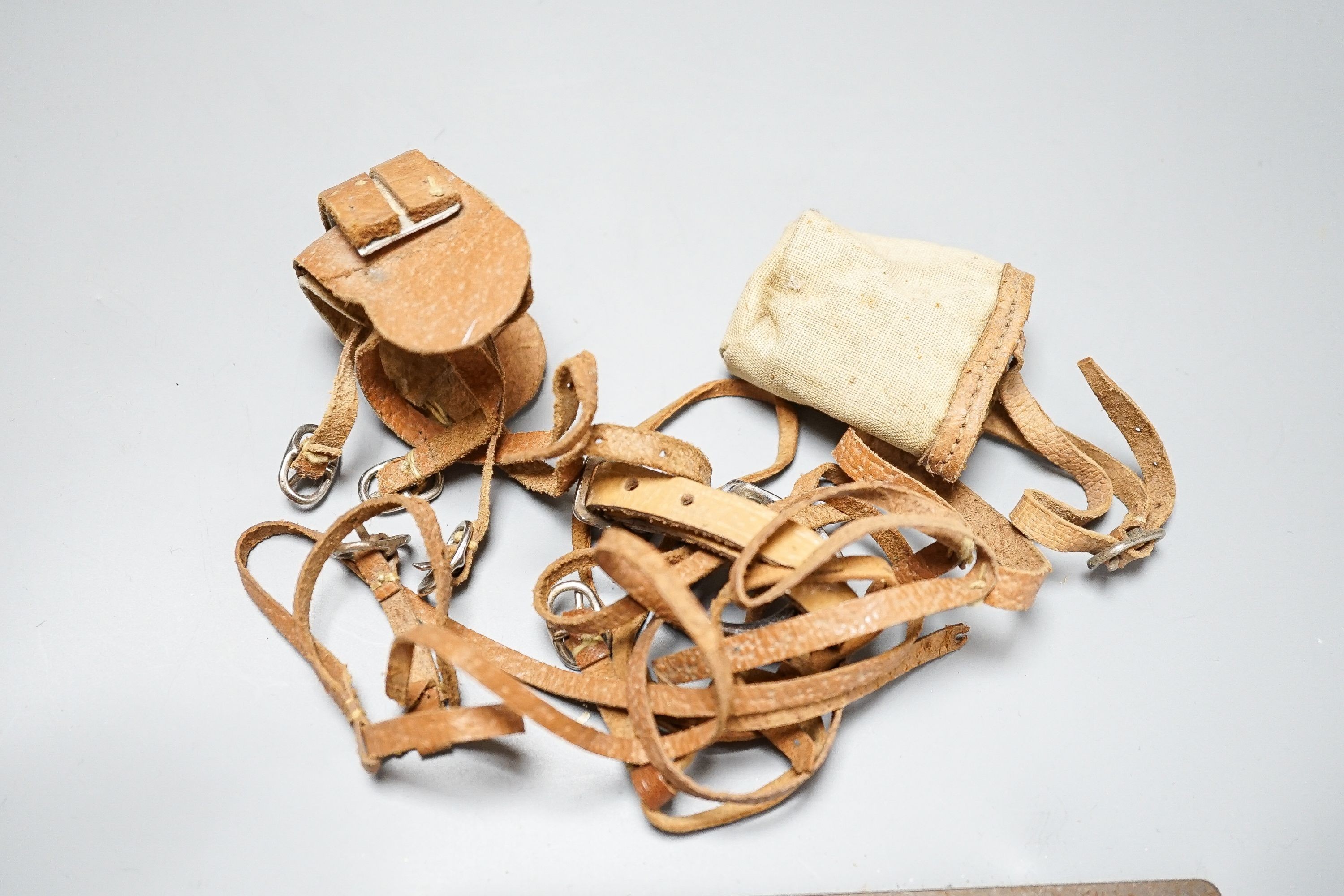 Two Edith Reynolds handmade real skin and leather horse models, 18cm high, together with a female jockey and related leather accessories